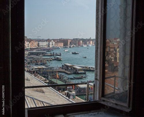 reflection in the window of a panoramic view of the city landscape and the Grand Canal in Venice