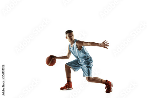 Full length portrait of young basketball player with a ball isolated on white studio background. Teenager training and practicing in action, motion. Concept of sport, movement, healthy lifestyle, ad. © master1305