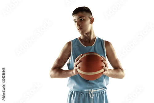 Full length portrait of young basketball player with a ball isolated on white studio background. Teenager confident posing with ball. Concept of sport, movement, healthy lifestyle, ad, action, motion.