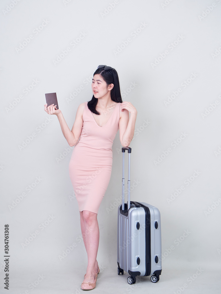 Young woman with suitcase on white background Young woman with suitcase on white background