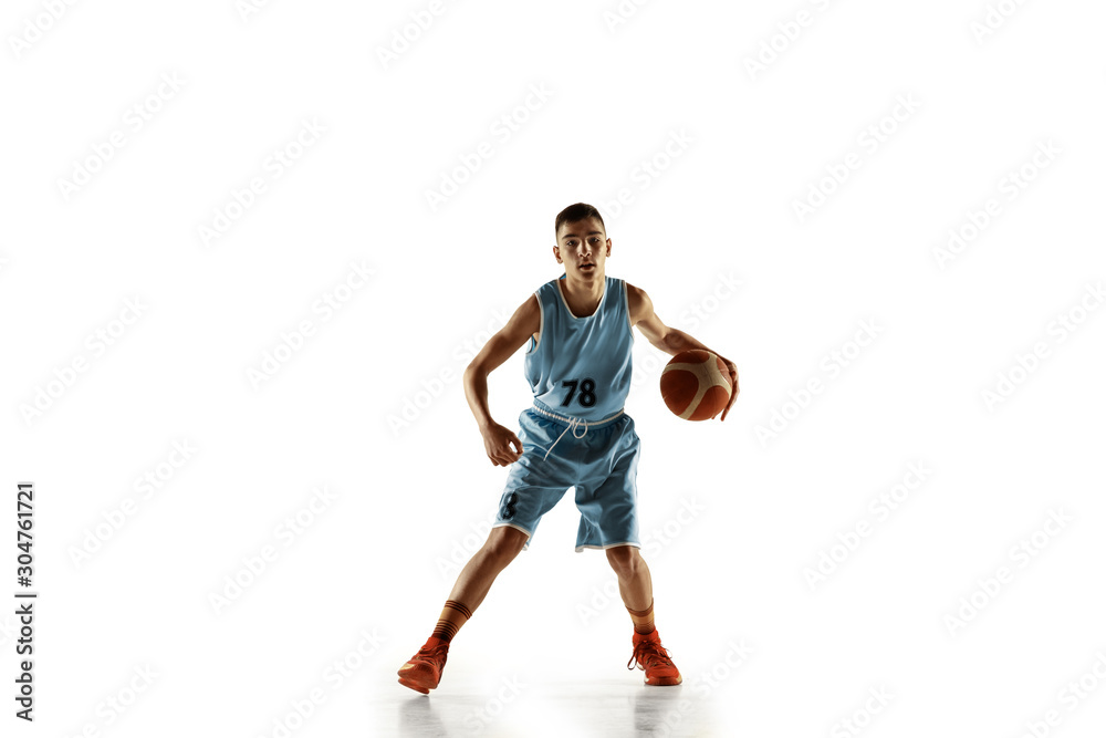 Full length portrait of young basketball player with a ball isolated on white studio background. Teenager training and practicing in action, motion. Concept of sport, movement, healthy lifestyle, ad. Full length portrait of young basketball player with a ball isolated on white studio background. Teenager training and practicing in action, motion. Concept of sport, movement, healthy lifestyle, ad.