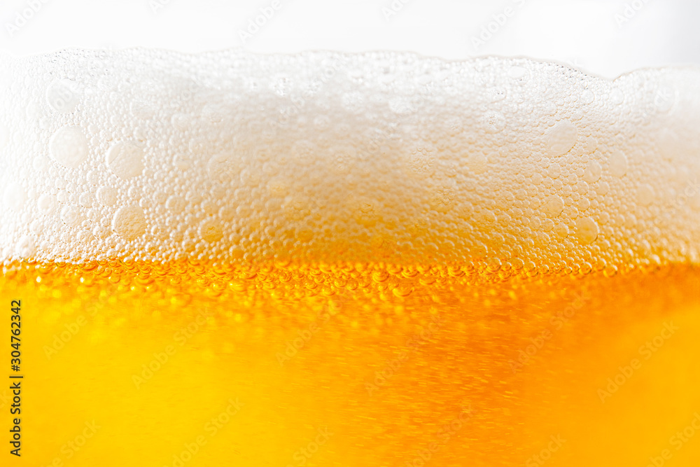 Light Beer with Bubbles and Foam Background on White. Beer Bubbles Texture Close Up Light Beer with Bubbles and Foam Background on White. Beer Bubbles Texture Close Up
