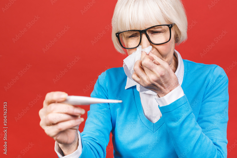 Ill allergic old mature woman blowing runny nose got hay fever rhinitis ...