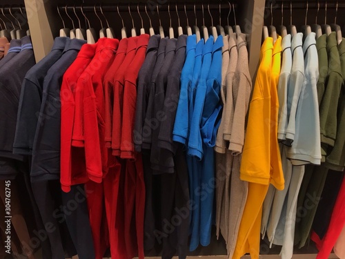 Many colors of clothes that hang in order to look beautiful and orderly. © 0nemylove
