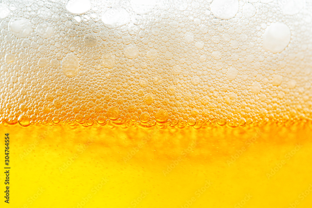 Light Beer with Bubbles and Foam Background. Beer Bubbles Texture Close Up Light Beer with Bubbles and Foam Background. Beer Bubbles Texture Close Up