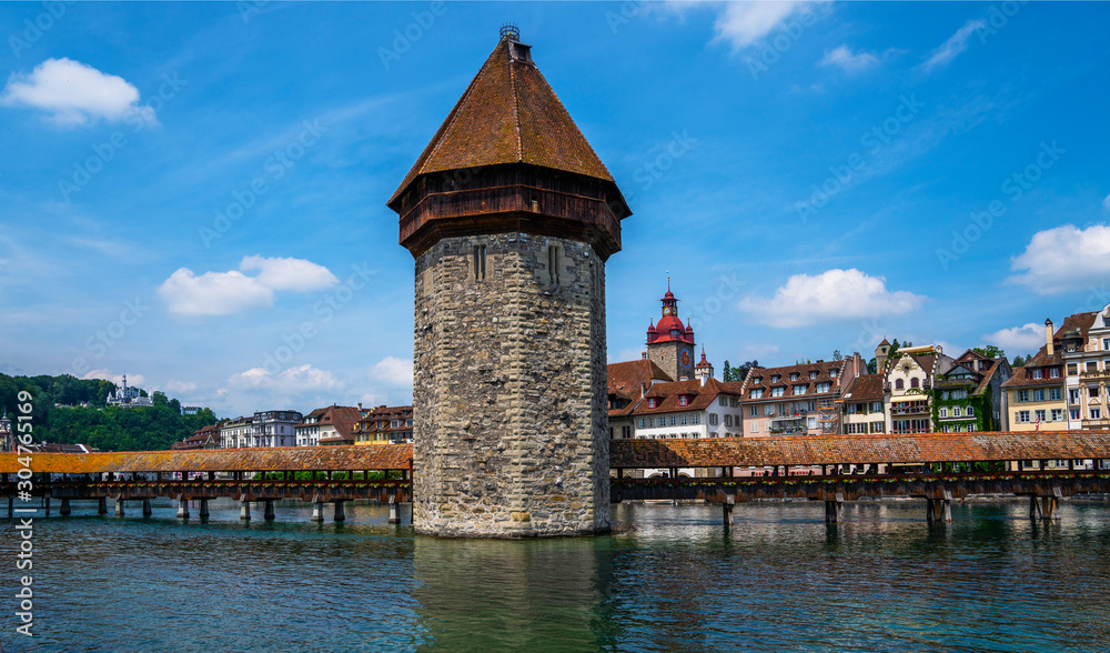 Scenic summer panorama of the Old Town medieval architecture in Lucerne, Switzerland. Beautiful historic city center view of Lucerne with famous Chapel Bridge and lake Lucerne.