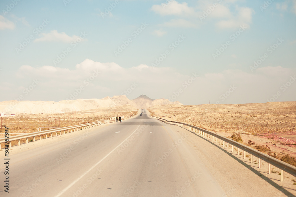 A beautiful photograph of a road in an open area. A beautiful photograph of a road in an open area.