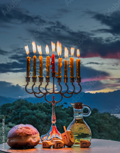 Main attributes of Hanukkah Jewish Holiday. Dreidels  -variant of a teetotum ...