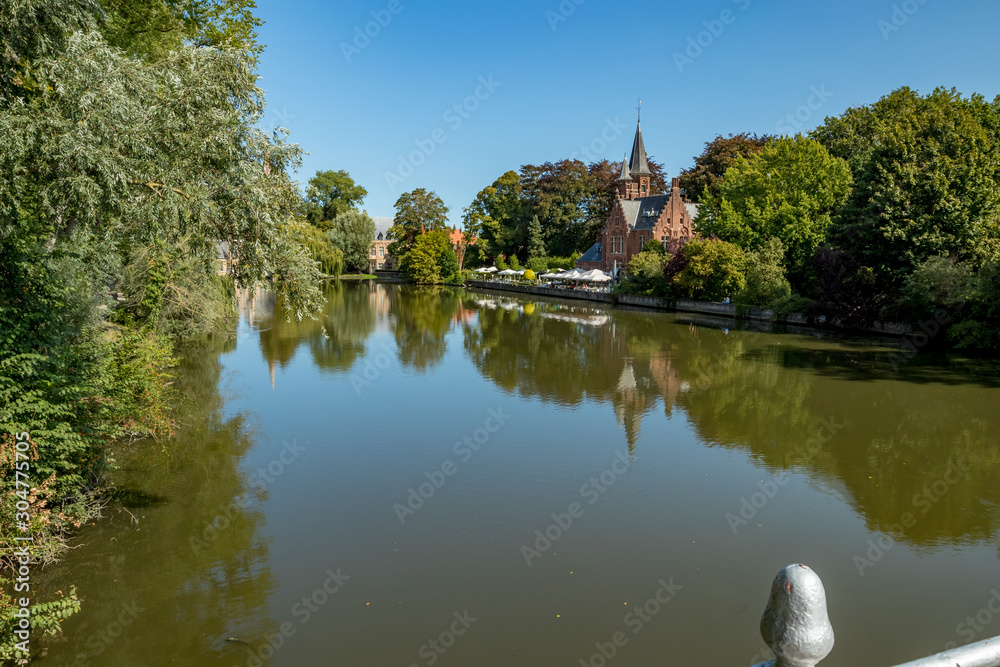 Street view of beautiful historic city center architecture of Bruges or Brugge, West Flanders province, Belgium. Lovely summer August weather Street view of beautiful historic city center architecture of Bruges or Brugge, West Flanders province, Belgium. Lovely summer August weather