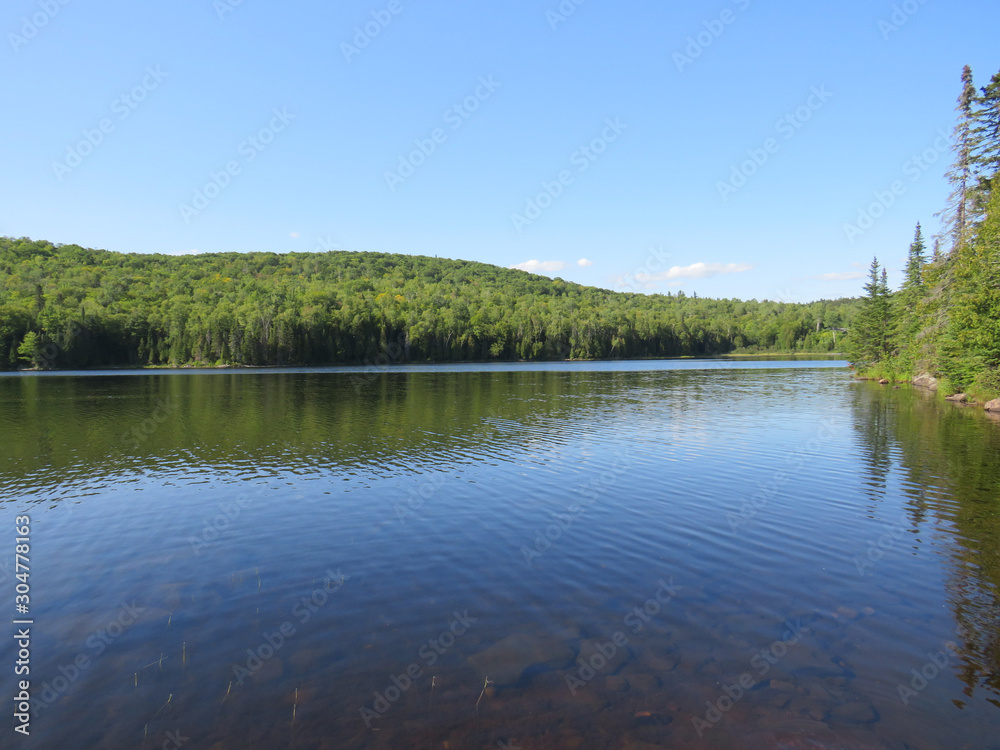 Viewpoint over Lake. La Mauricie National Park, Quebec Canada.Look out point with blue sky and tranquil waters landscape