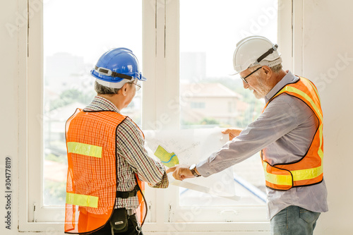 Happy professional worker working together home builder architecture mix race in construction site