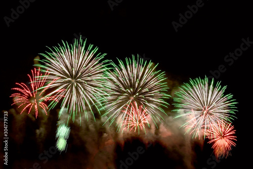 Flashes of colorful festive fireworks