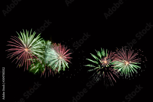 Flashes of green, red and white fireworks