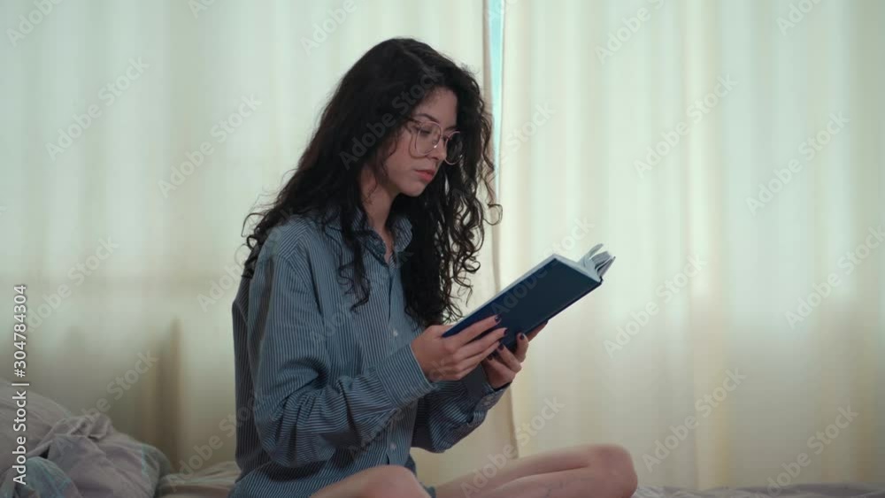 pretty brunette woman in morning bed with books and coffee pretty brunette woman in morning bed with books and coffee