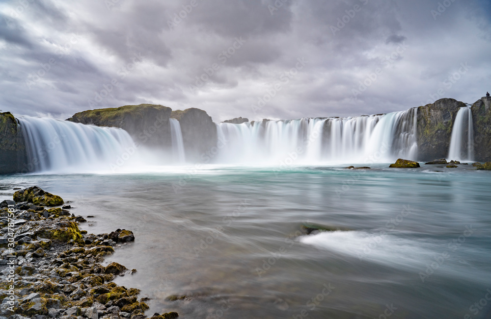 Godafoss waterfall, foggy from waterspray on a cloudy morning, Iceland Godafoss waterfall, foggy from waterspray on a cloudy morning, Iceland