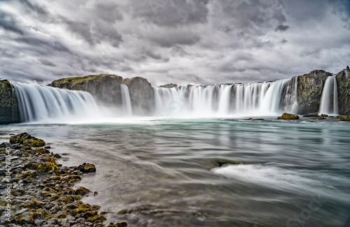 Godafoss waterfall  foggy from waterspray on a cloudy morning  Iceland