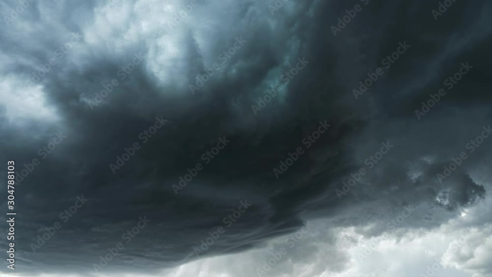 Dark dramatic storm cell spinning in the sky during extreme weather warning.