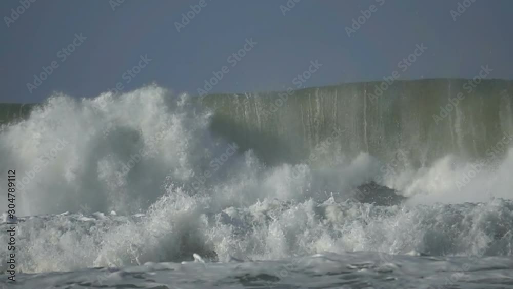 Ocean Wave big wave stormy sea spray foam blue sky Ocean Wave big wave stormy sea spray foam blue sky