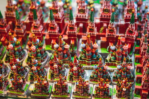 View of traditional souvenirs from Moscow, Russia, with fridge magnets with "Moscow" text, Kremlin and St. Basil Cathedral figure at local vendor souvenir shop on Red Square