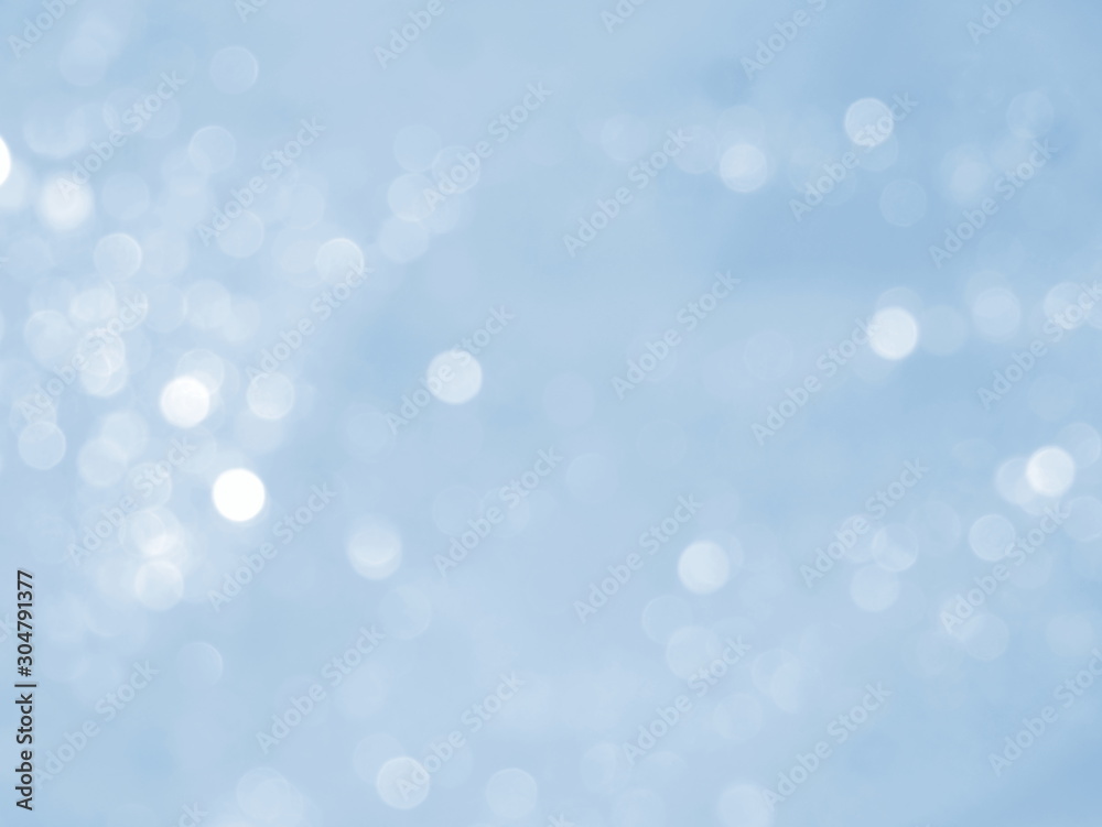 Blue background with abstract bokeh. Winter lights. Blue background with abstract bokeh. Winter lights.