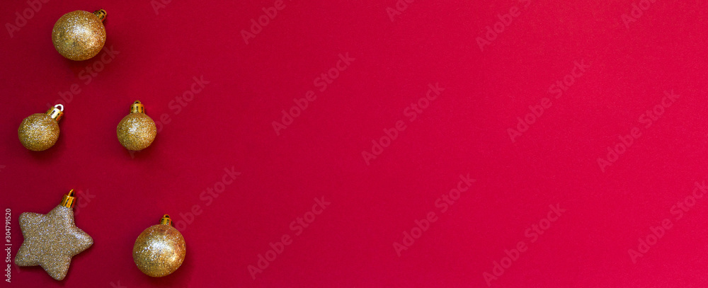 Christmas border. Fir branches and ornament on red background with copy space for your text. Christmas greeting card. Winter xmas holiday theme. Happy New Year. Christmas border. Fir branches and ornament on red background with copy space for your text. Christmas greeting card. Winter xmas holiday theme. Happy New Year.