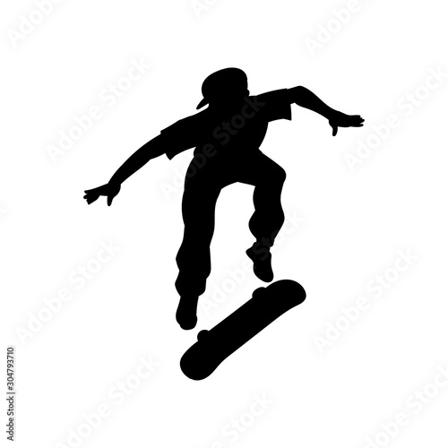 Black skateboarder man doing extreme jump while flipping a skateboard