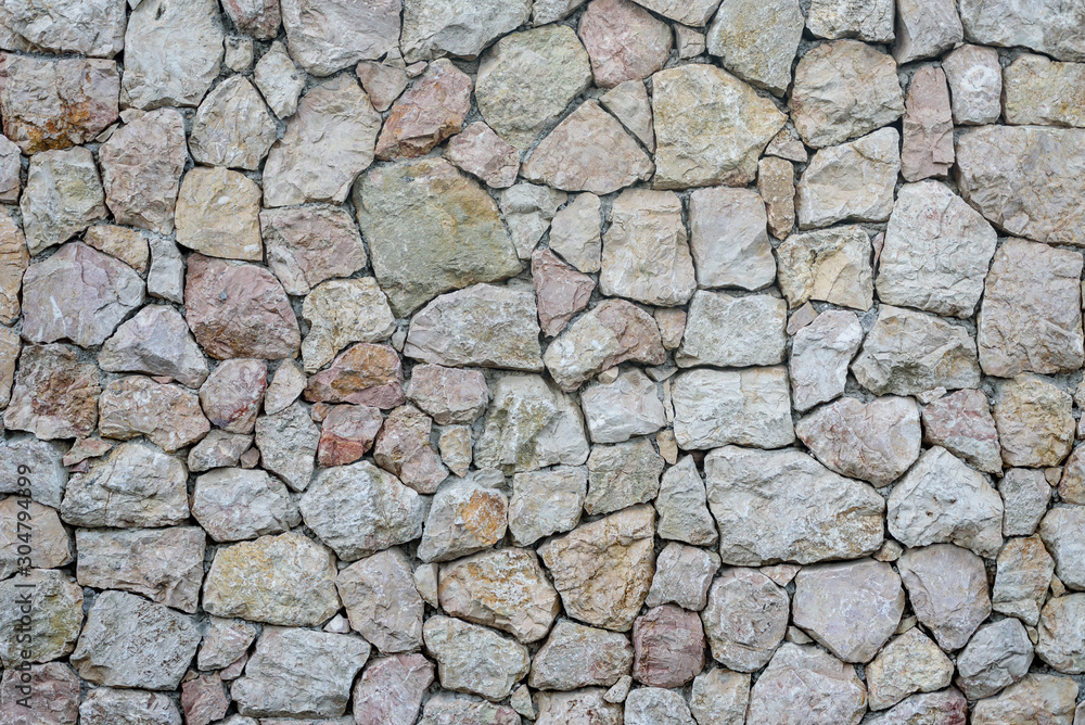 The texture of the wall is masonry. Background image. The texture of the wall is masonry. Background image.