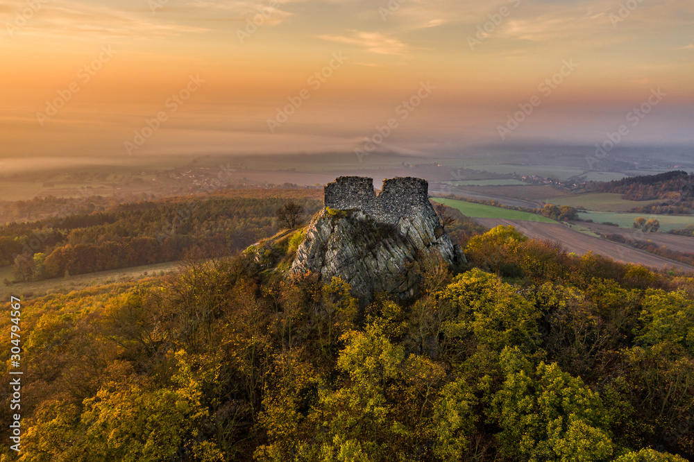 Oltarik is a castle ruin on the hill of the same name in the Ceske stredohori Mountains. It rises above the village of Dekovka ten kilometers southwest of Lovosice in the district of Litomerice