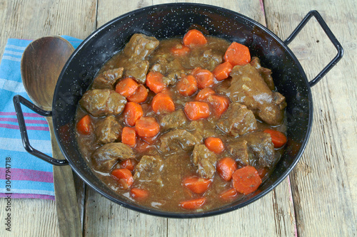 beef and carrot cooked in a dish