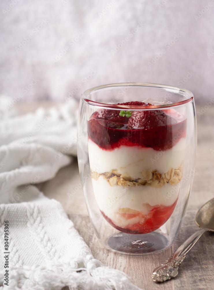 Sweet food, diet nutrition and organic dairy concept - yogurt, homemade granola with strawberry jam, muesli for healthy breakfast in the morning. Sweet food, diet nutrition and organic dairy concept - yogurt, homemade granola with strawberry jam, muesli for healthy breakfast in the morning.
