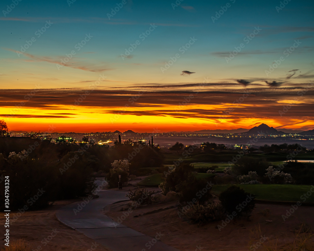 the sun setting on Phoenix Arizona.