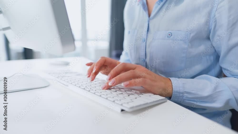 Female hands typing on a computer keyboard Female hands typing on a computer keyboard