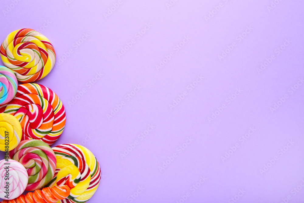 Lollipops on a lilac background, Sweets concept