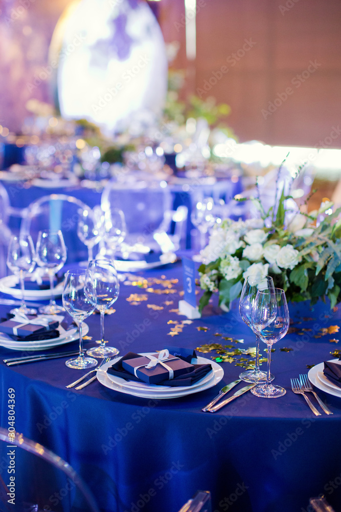 Fototapeta premium Beautiful table setting with white and green flowers. Space theme wedding decorations