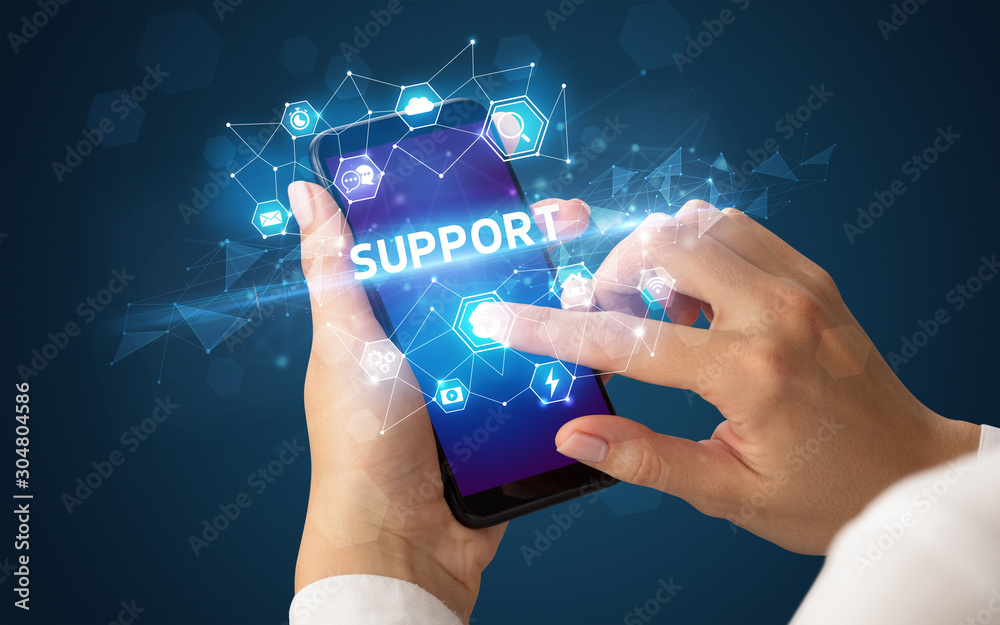 Female hand holding smartphone with SUPPORT inscription, modern technology concept Female hand holding smartphone with SUPPORT inscription, modern technology concept