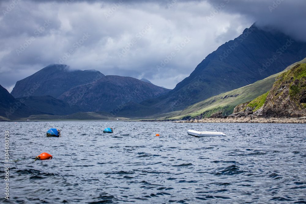 Beautiful scenic landscape of amazing Scotland nature with boat.