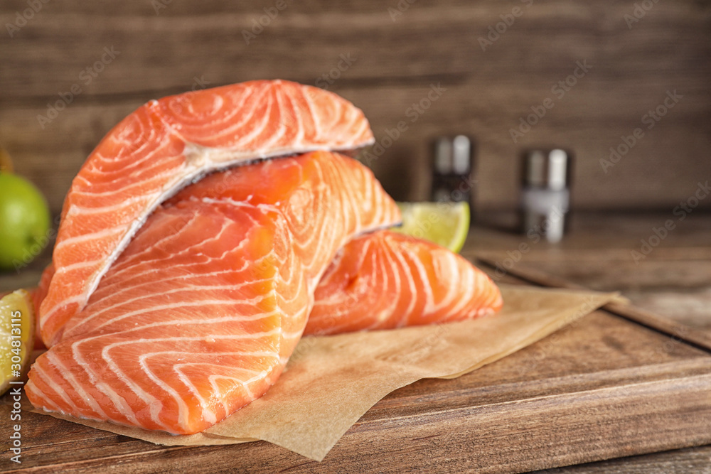 Fresh raw salmon on wooden board. Fish delicacy Fresh raw salmon on wooden board. Fish delicacy