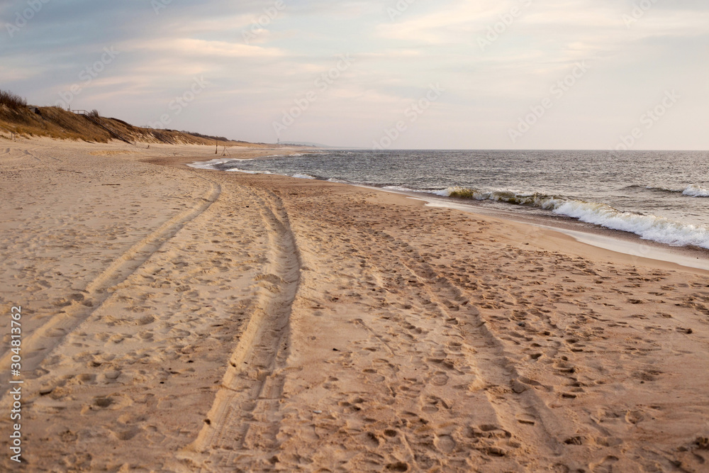 Beautiful sunset seascape with sand beach in evening. Beautiful sunset seascape with sand beach in evening.