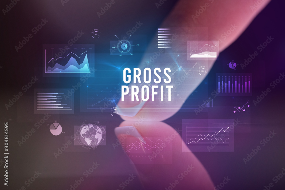 Finger touching tablet with charts and GROSS PROFIT inscription, business concept Finger touching tablet with charts and GROSS PROFIT inscription, business concept