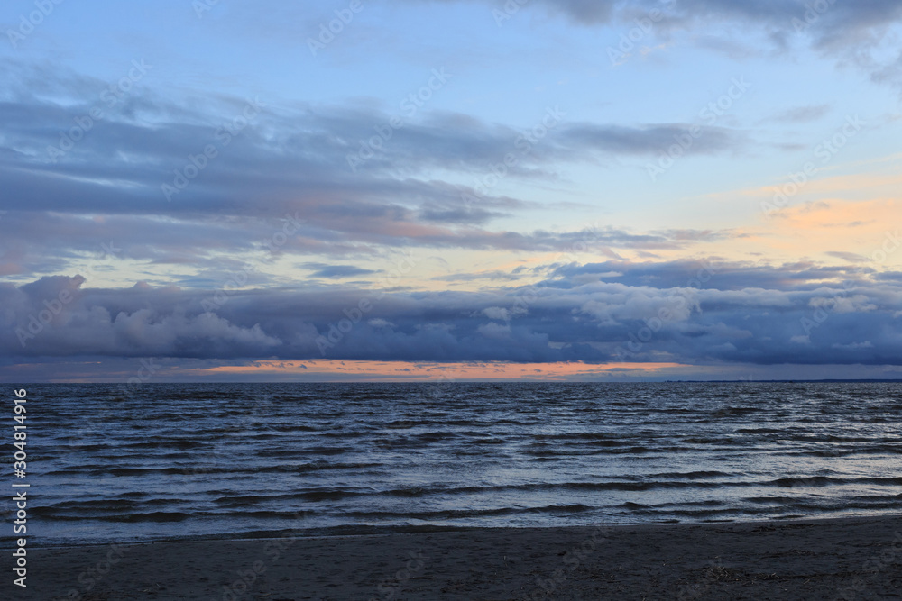 View of the Parnu Bay in evening in overcast whether. It a bay in the northeastern part of the Gulf of Livonia (Gulf of Riga of Baltic Sea), in southern Estonia. View of the Parnu Bay in evening in overcast whether. It a bay in the northeastern part of the Gulf of Livonia (Gulf of Riga of Baltic Sea), in southern Estonia.