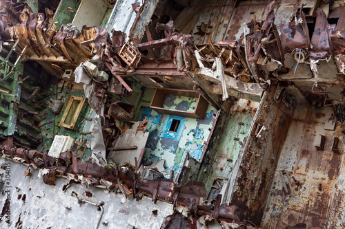 Internal parts of decommissioned marine ship that was cut and left on the shore. photo