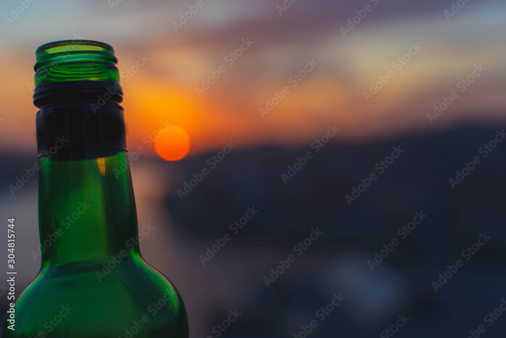 bottle on sunset light background. enjoying summer sunset. Alcohol beverage. bottle on sunset light background. enjoying summer sunset. Alcohol beverage.