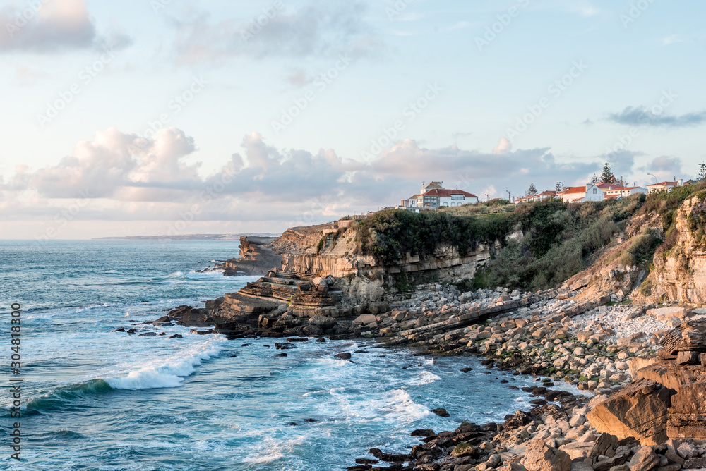 Coastline view of Portugal village on cliffs above Atlantic ocean