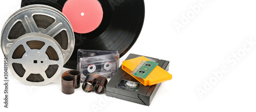 Slika na platnu Vinyl record, video and audio cassettes isolated on white background