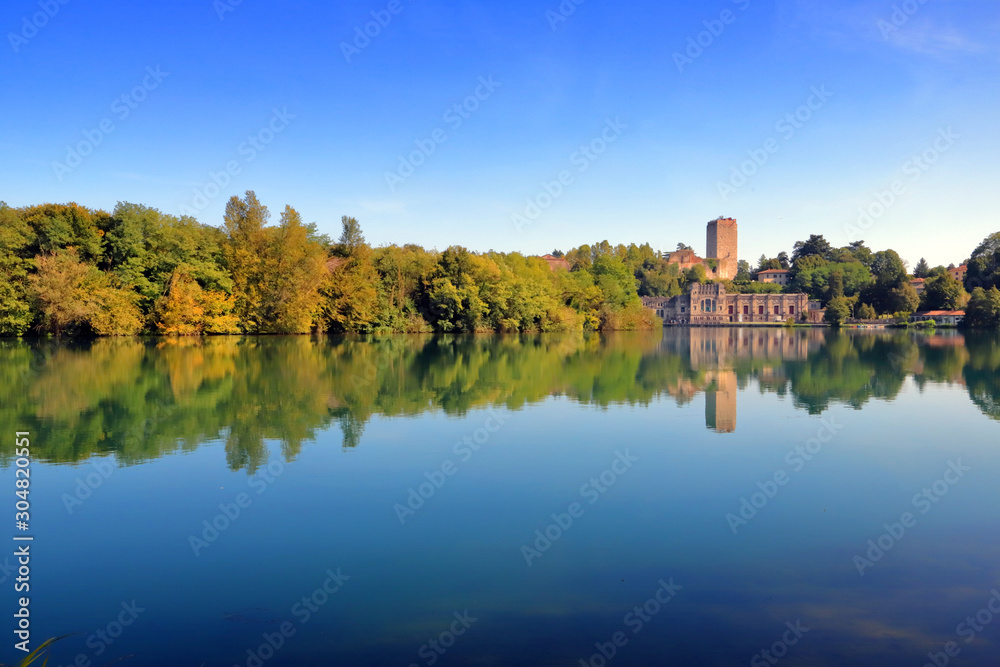 Fototapeta premium adda river with trees and reflections in italy