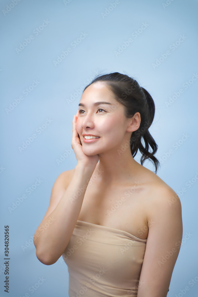 Obraz premium attractive asian woman skin care image on white background