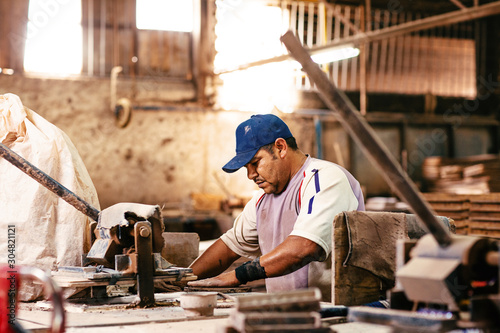 Man working in tile factory in Mexico