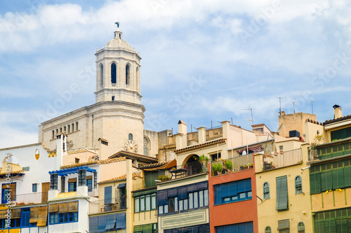 Cathedral of Saint Mary of Girona over city houses roofs, Catalonia, Spain.