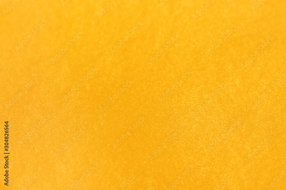 Closeup view of yellow slime as background. Antistress toy