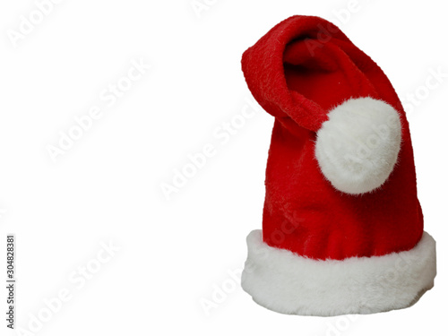 A bright red christmas elf hat with white pompom and background